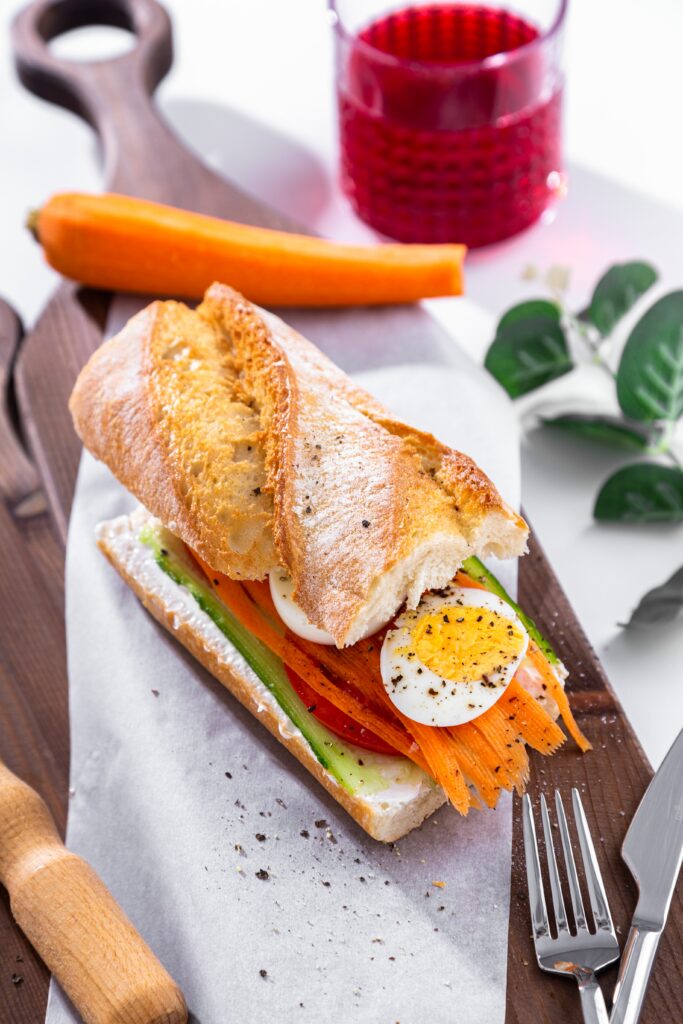 All Foods Fit, white Ciabatta bread with sliced hard-boiled eggs and veggies
