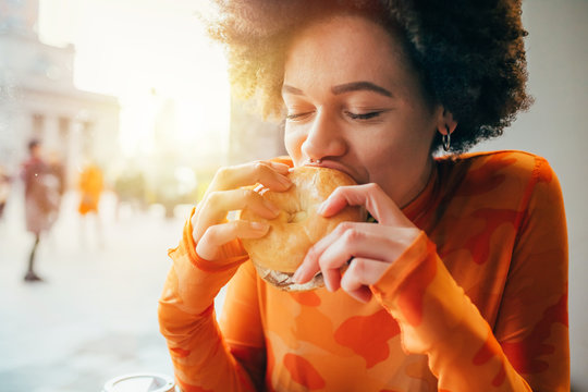 oman enjoying a sandwich as she learns how to raise an intuitive eater and become one, too.