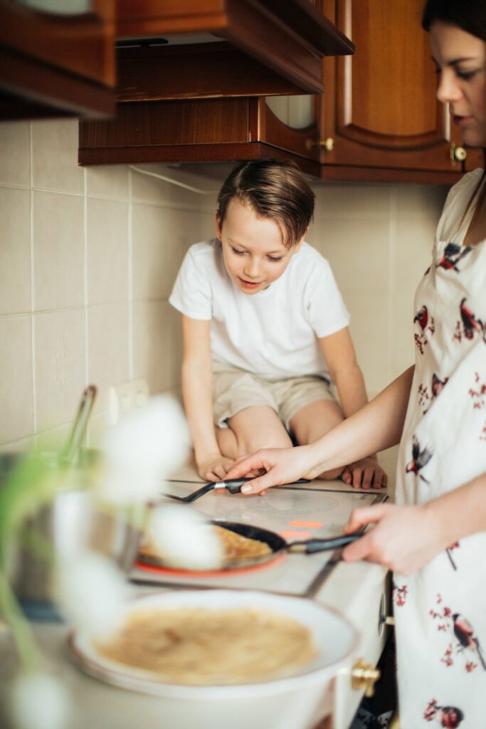 how to raise an intuitive eater starts with you; here a parent is cooking with child